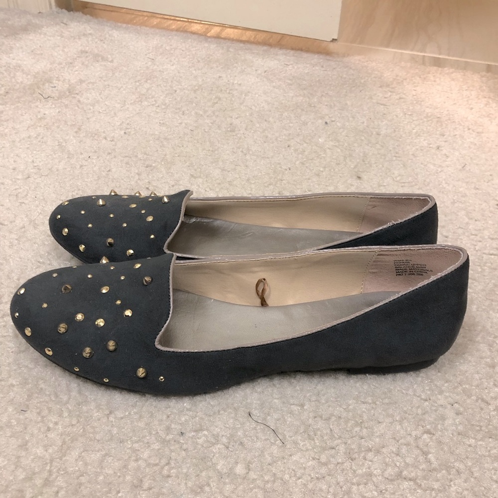 Like new medium to dark gray cigarette style flat with gold stud detail